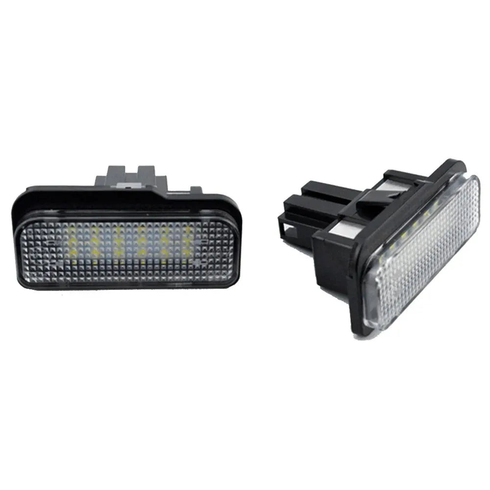 Mercedes Benz LED licence plate light unit with 18 white LEDs, shown next to a ruler for scale.