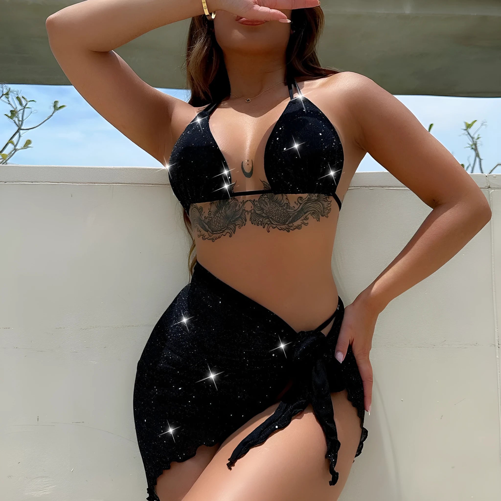 Black polyester fibre bikini set comprising a top and matching shorts on a mannequin.