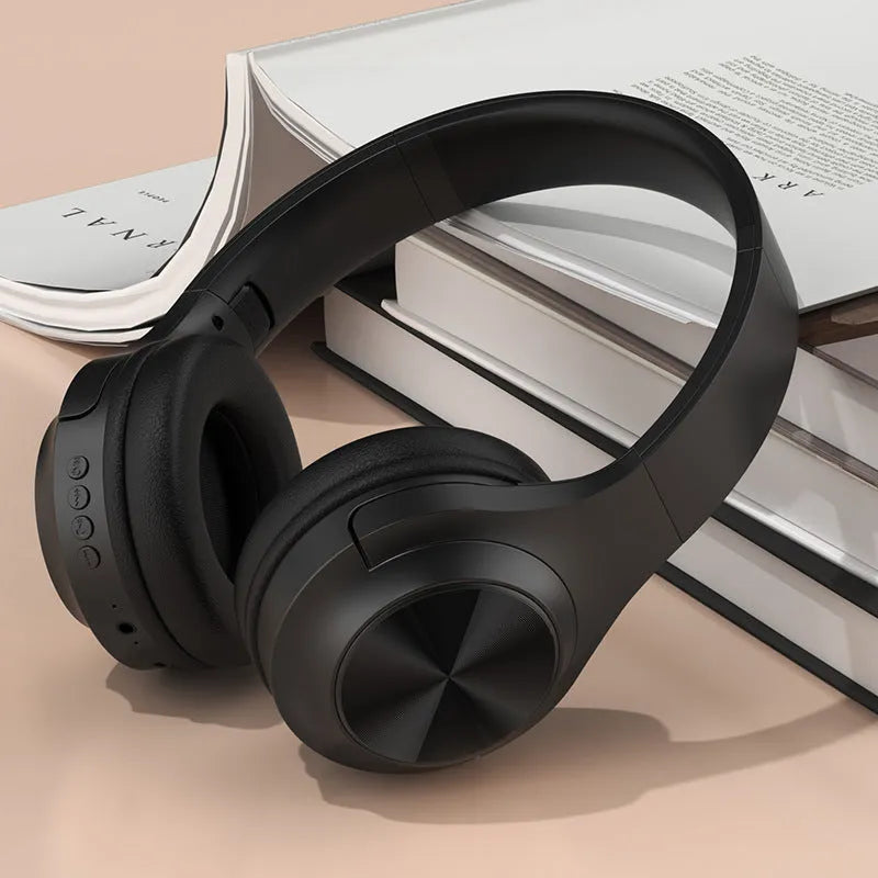 Creative design wireless Bluetooth headset in ivory white colour with a matching charging case.