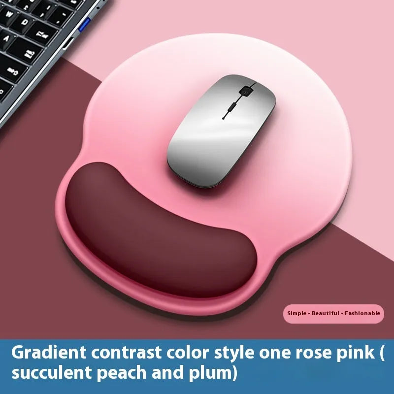 Silicone mouse mat with wrist support in gradient colour pattern on desk