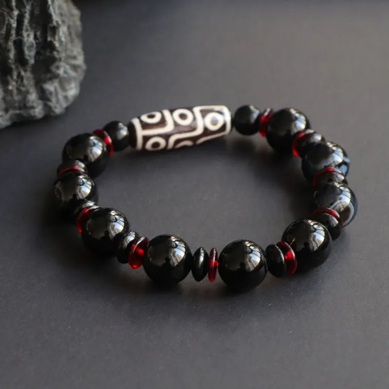 Black agate dzi bead bracelet with 11mm round beads in hand-woven geometry pattern