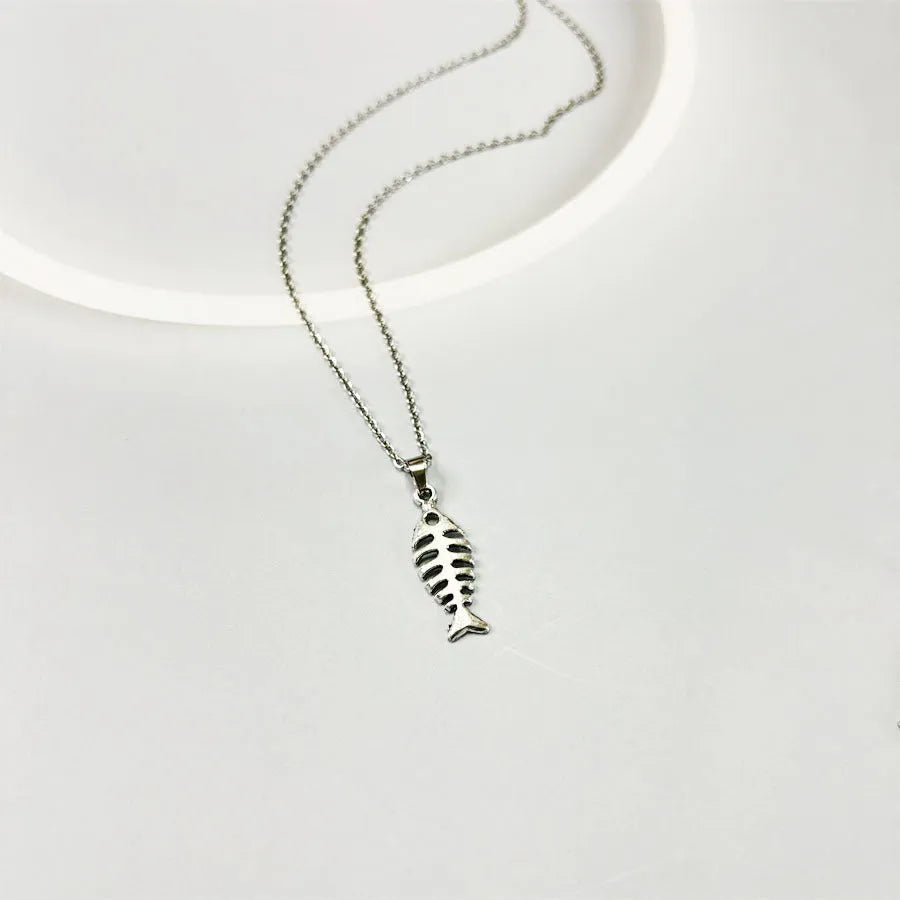 Women's vintage fishbone pendant necklace and matching earrings set with adjustable chain.