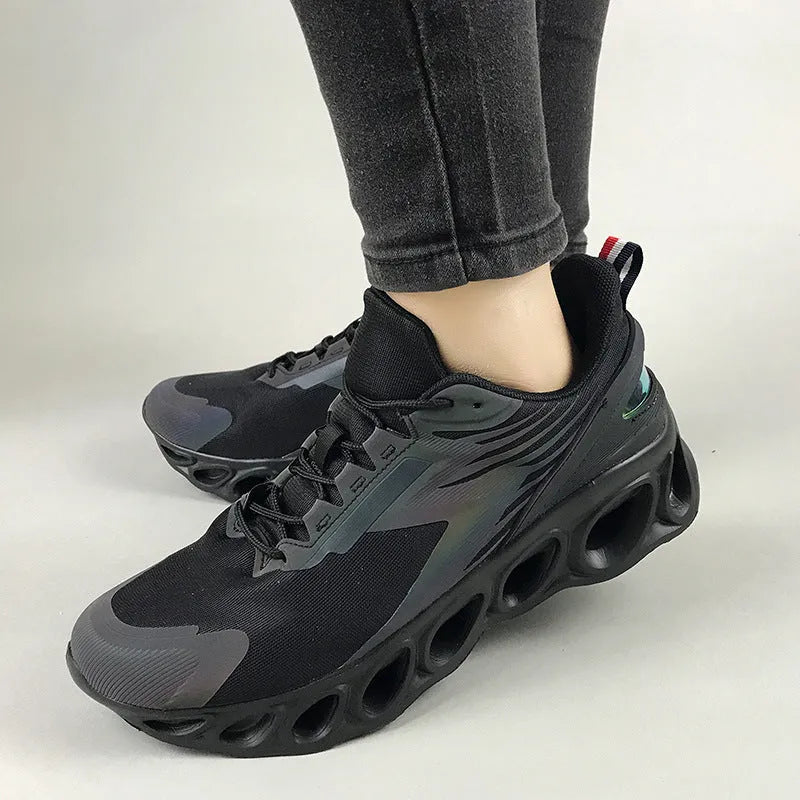 Black breathable low-top casual sports shoes with mesh upper and white stitching on a flat EVA sole.