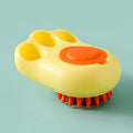 Blue silicone claw-shaped pet bath brush with flexible bristles for washing cats and dogs.