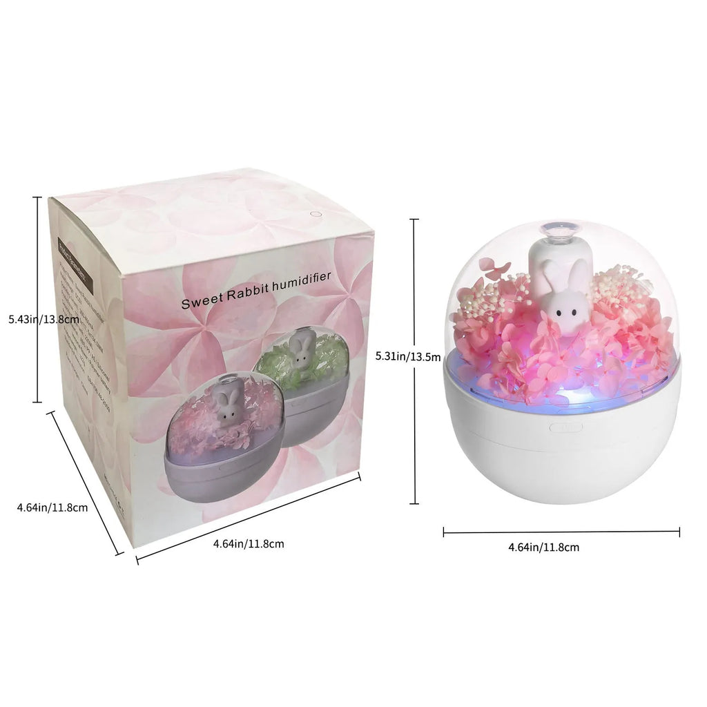 Pink rabbit-shaped aromatherapy humidifier with preserved flowers on top, USB powered for bedroom use.