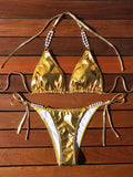 Gold halter lace-up bikini swimsuit with pearl chain detail, shown in Asian sizes