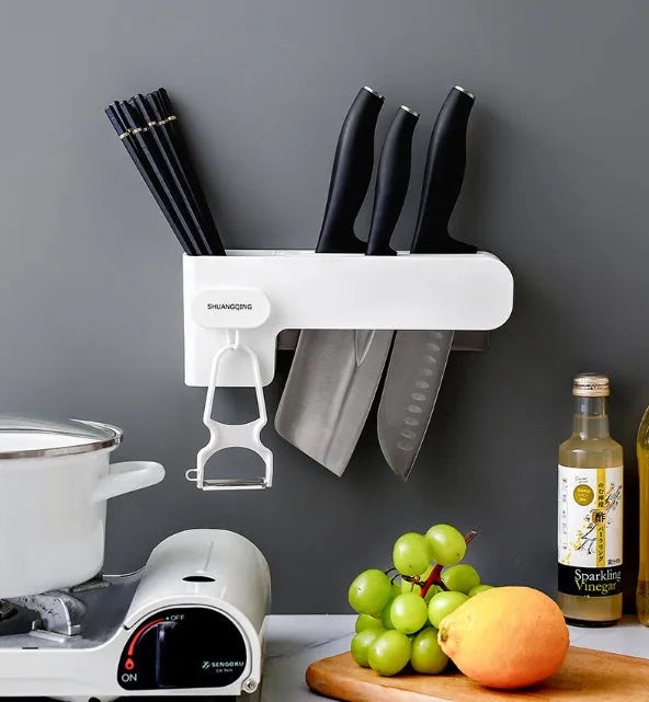 White plastic kitchen knife storage block with modern simple design on countertop