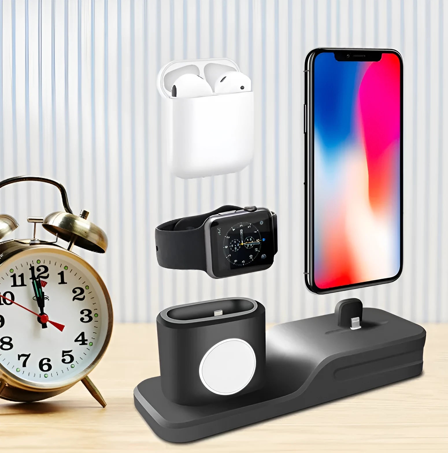 Black silicone 3-in-1 charging base for Apple-compatible iPhone, iWatch and AirPods devices on flat surface