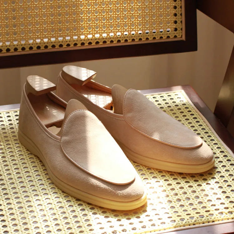 Men's handmade British brown leather loafers with a flat profile and TPR sole.