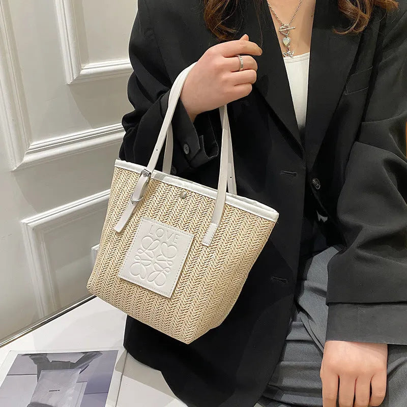 Women's woven straw shoulder bag with European retro style showing large opening and three-dimensional pockets