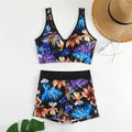 Women's two-piece swimsuit set showing sleeveless top and matching printed boxer shorts in a floral pattern.