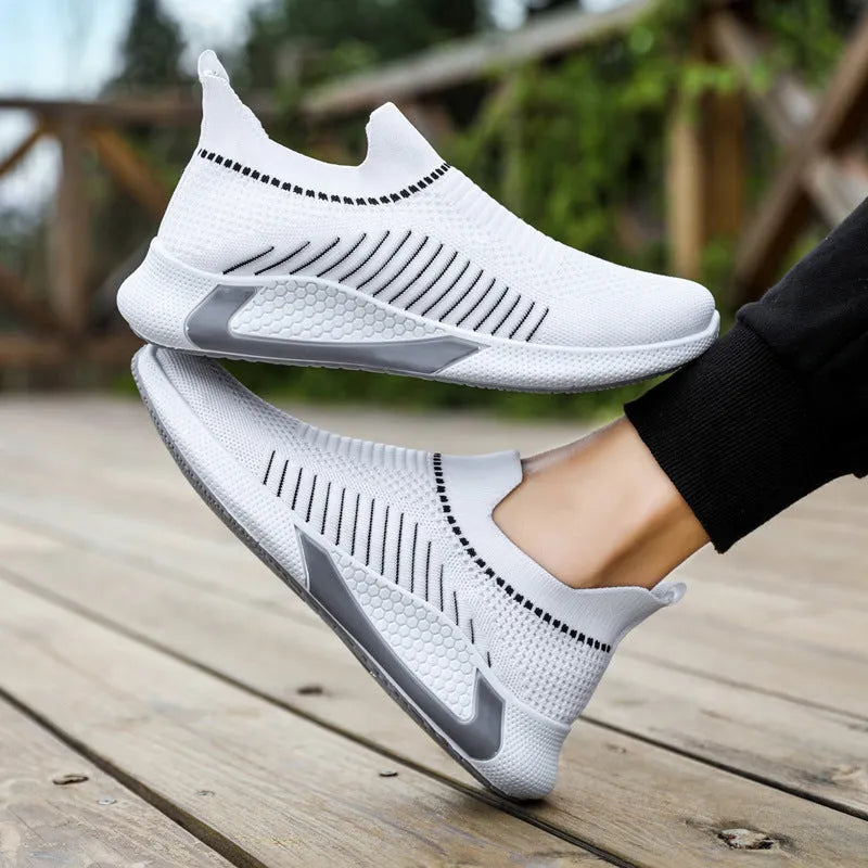 Men's black and white striped mesh sock sneakers with lace-up front and round toe.