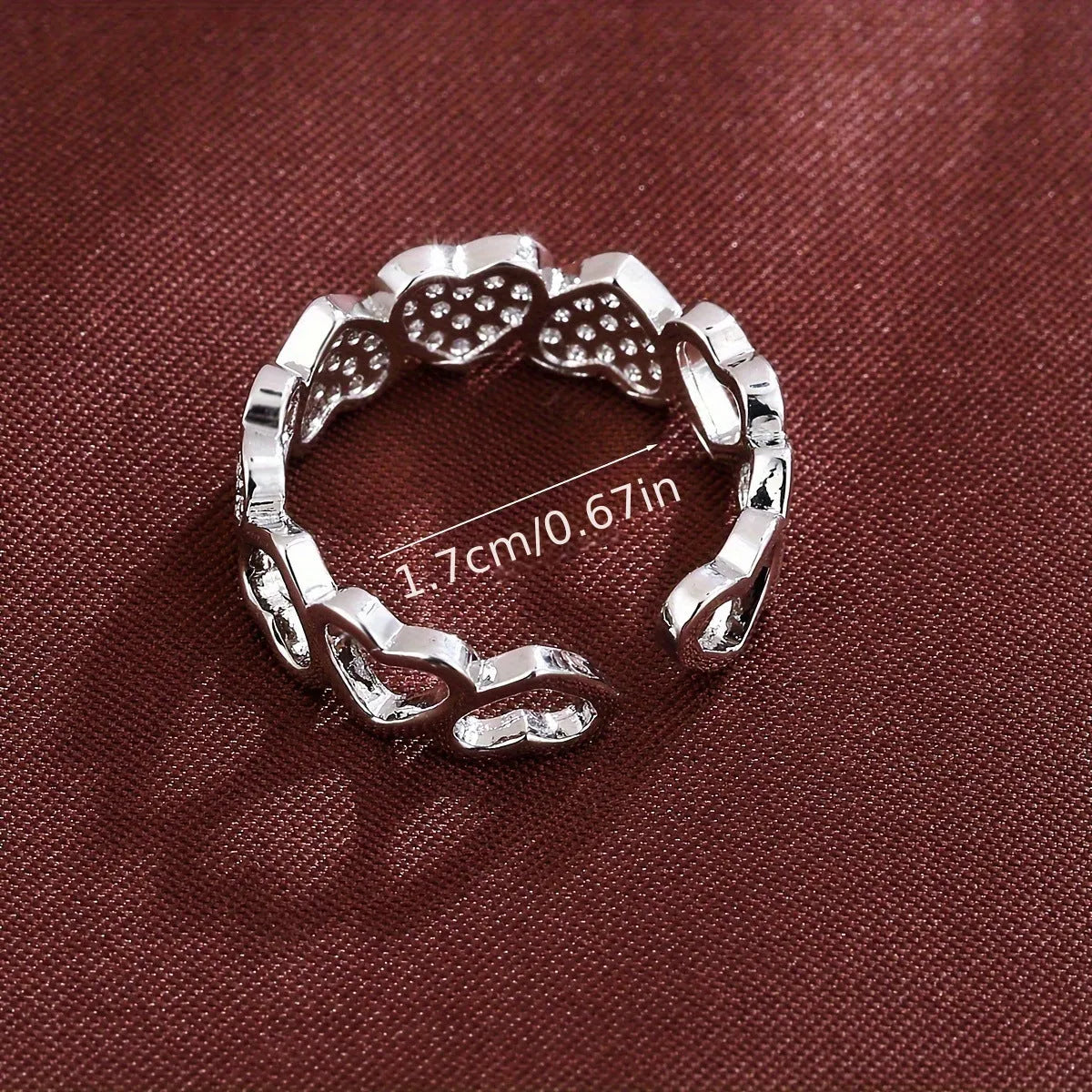 Adjustable gold and silver couples ring with love heart design on a geometry band.