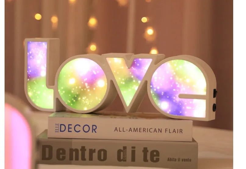 Rainbow halo style LED LOVE decorative light measuring 35.5cm wide
