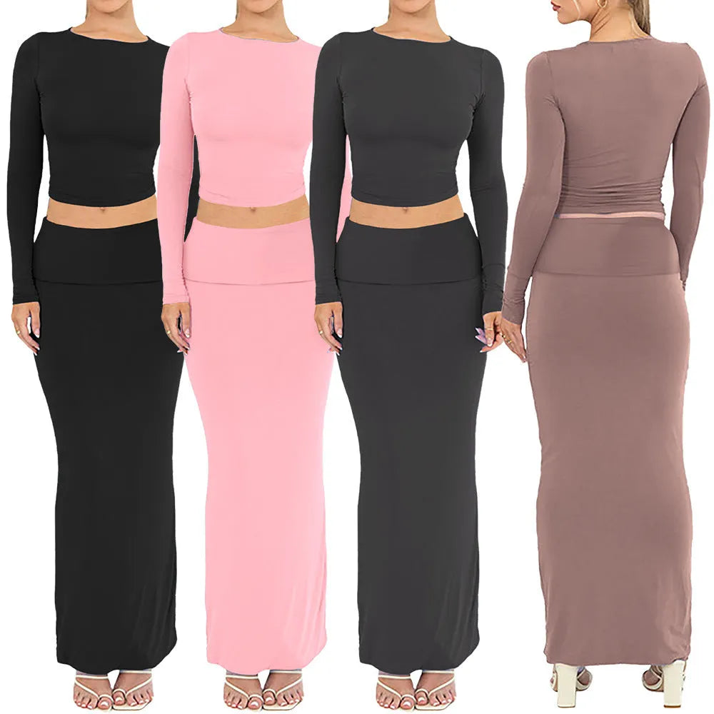 Women's sweet style polyester two-piece suit with three-quarter sleeve top and long skirt.