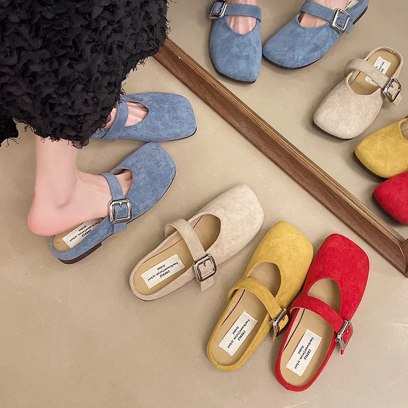 Women's flat closed-toe half slipper in a choice of colours, showing square toe and rubber sole.