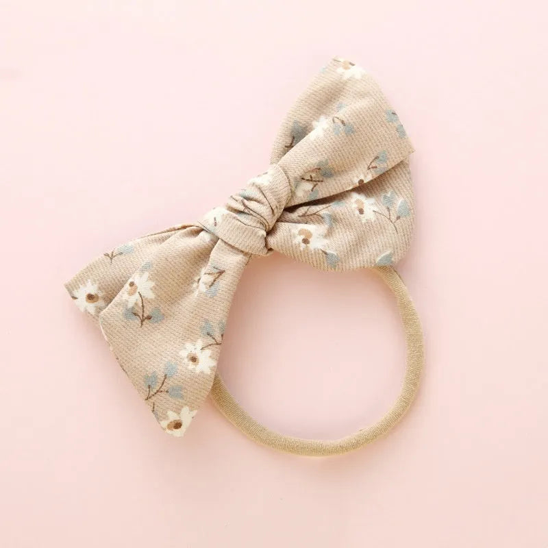Children's knotted bow hair band in cloth fabric with six colour options