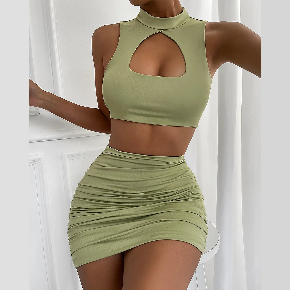 Women's light purple two-piece set with hollow vest top and high-waist split skirt