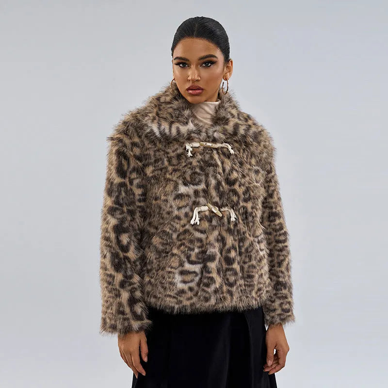 Women's leopard print coat with a buckle lapel fastener on a hanger.