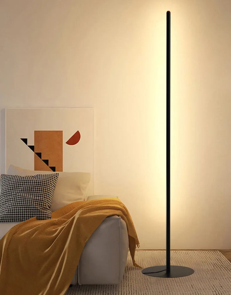 Tall, slim aluminium alloy vertical floor lamp with a simple design and LED light.