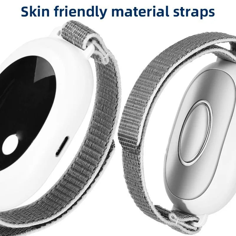 White insomnia help device with sleep bracelet, handheld remote control, and USB charging cable