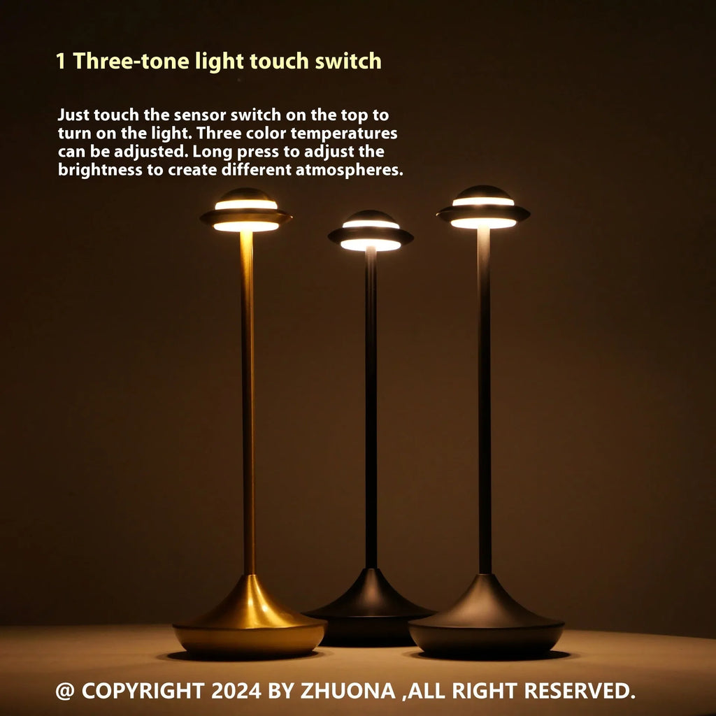 Modern metallic UFO-shaped rechargeable table lamp with touch dimming in black finish.