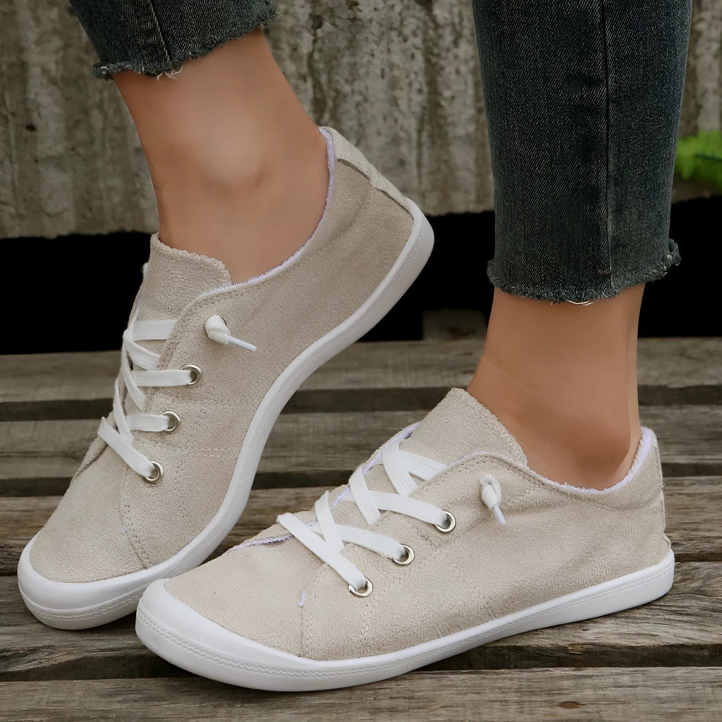 Women's creamy white fabric casual sneakers with low-top design and rubber sole