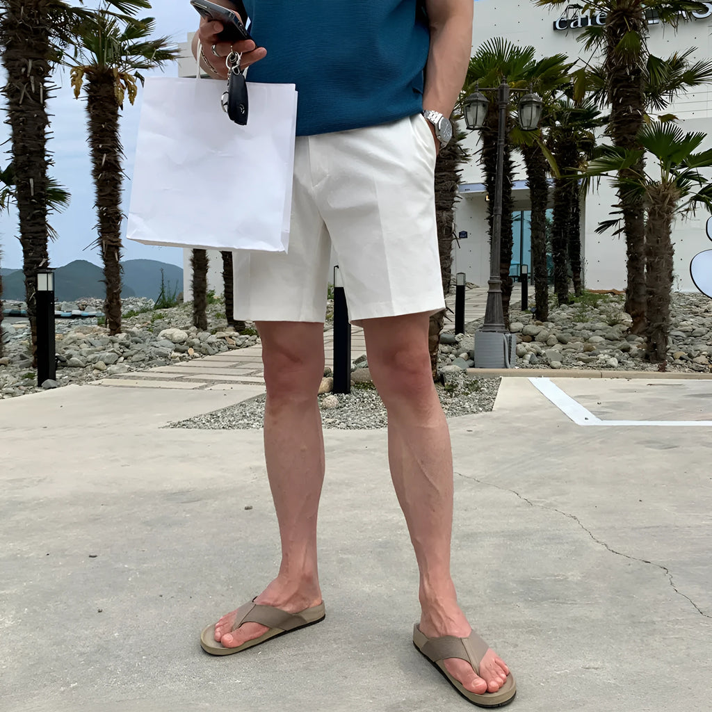 Men's straight-leg casual shorts in solid black colour, laid flat to show loose fit.