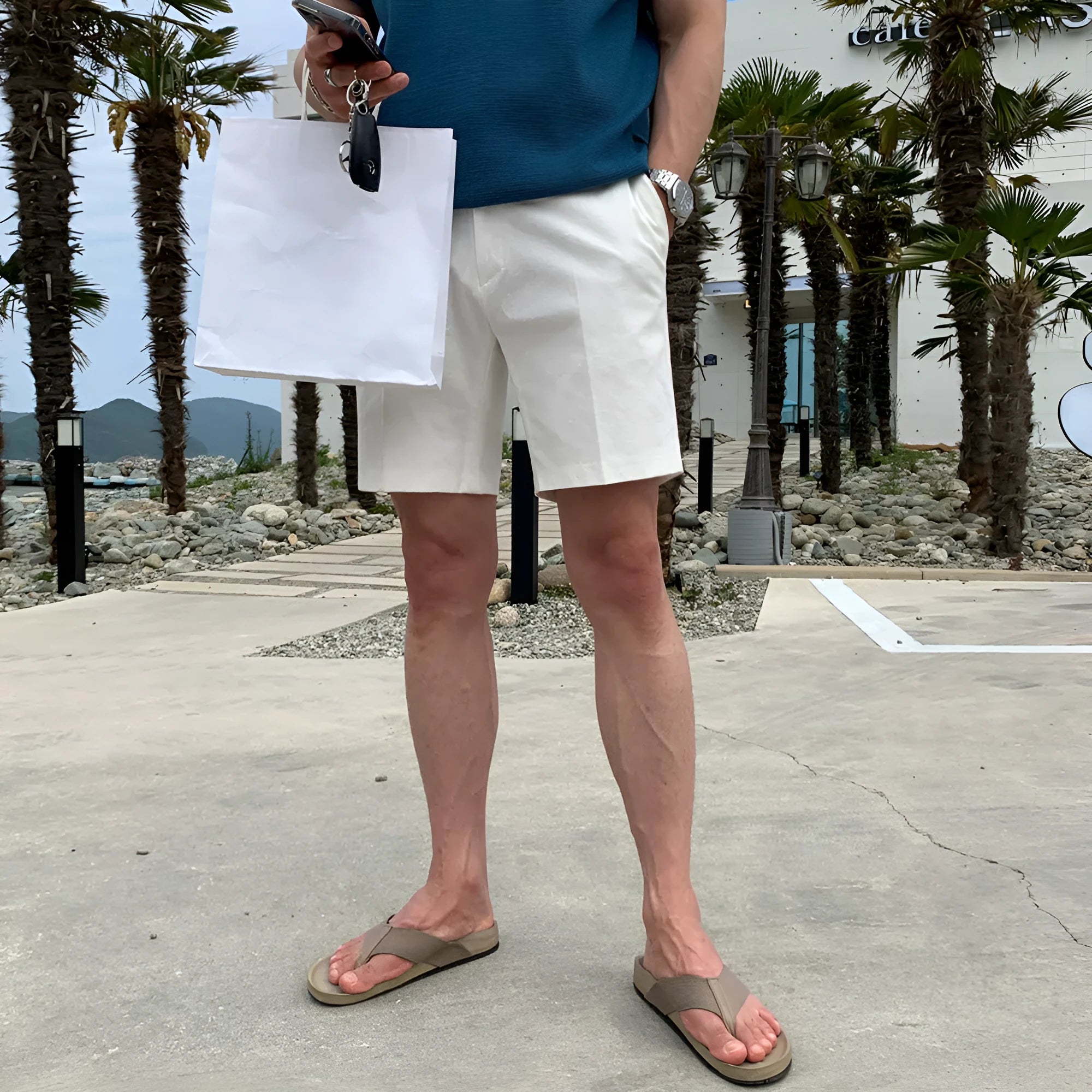Men's straight-leg casual shorts in solid black colour, laid flat to show loose fit.