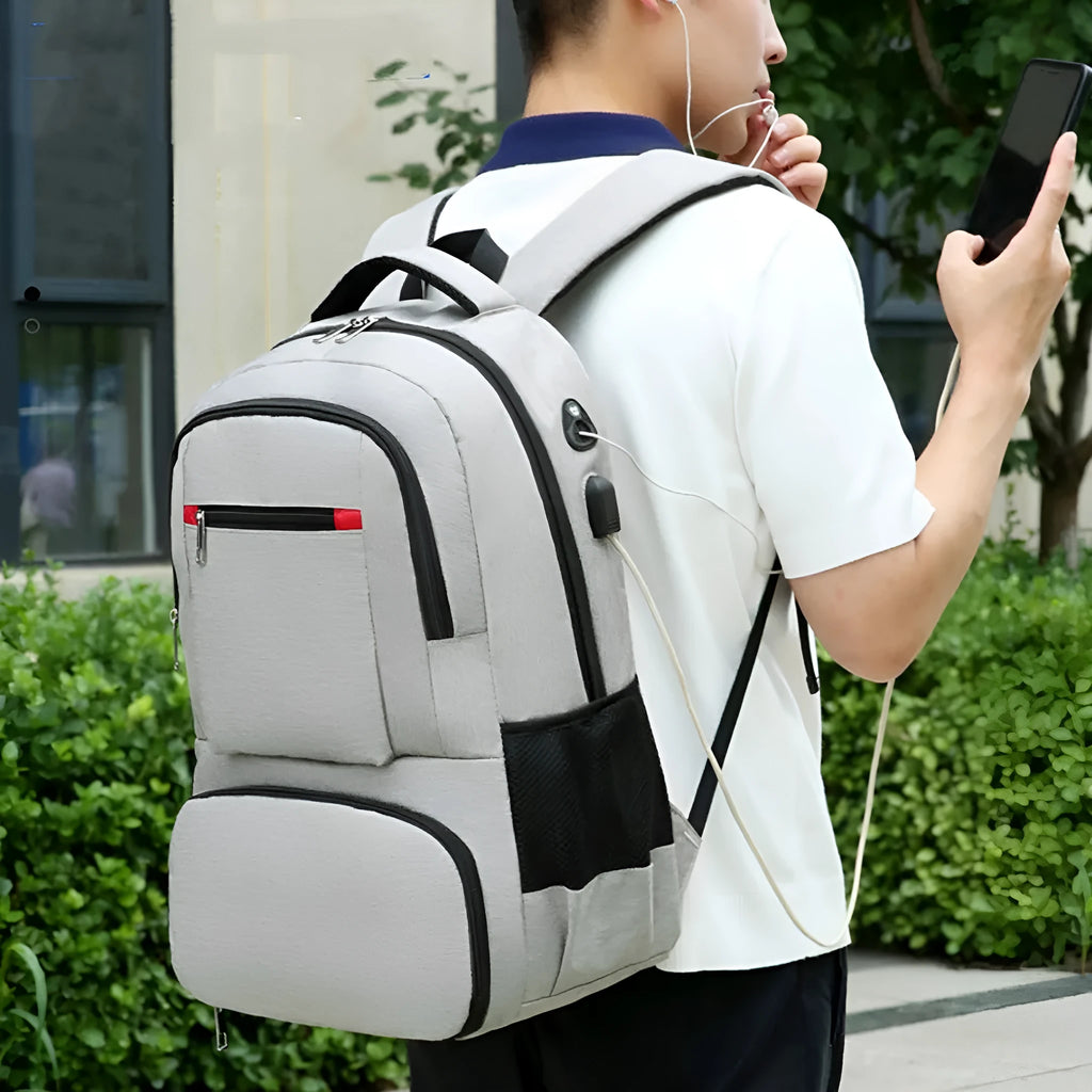Insulated Oxford cloth backpack in light grey showing compartments and curved shoulder straps.