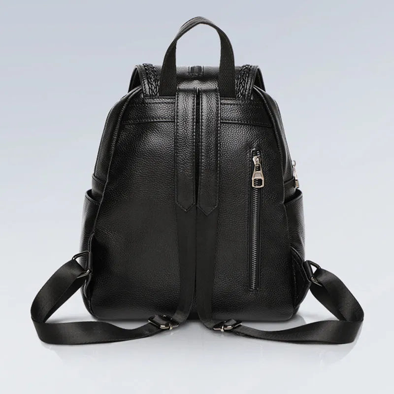 Blue genuine leather women's backpack with street style design showing internal organiser compartments