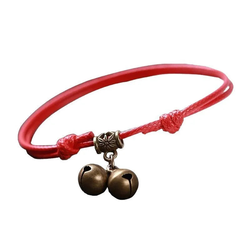 Adjustable nylon dog collar with brass bell and buckle in black, red, or coffee rope.
