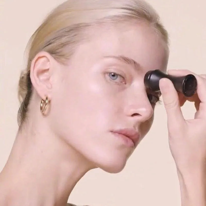 Volcanic stone portable roller for oily skin control in black, green, pink, or white.
