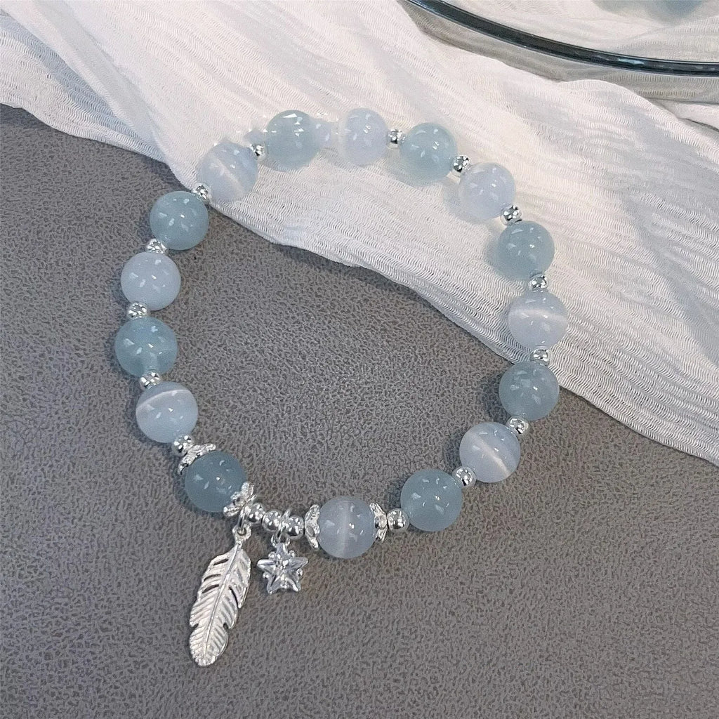 Korean style glass crystal bracelet with feather XingX blue moonlight colour and eight Awn star design