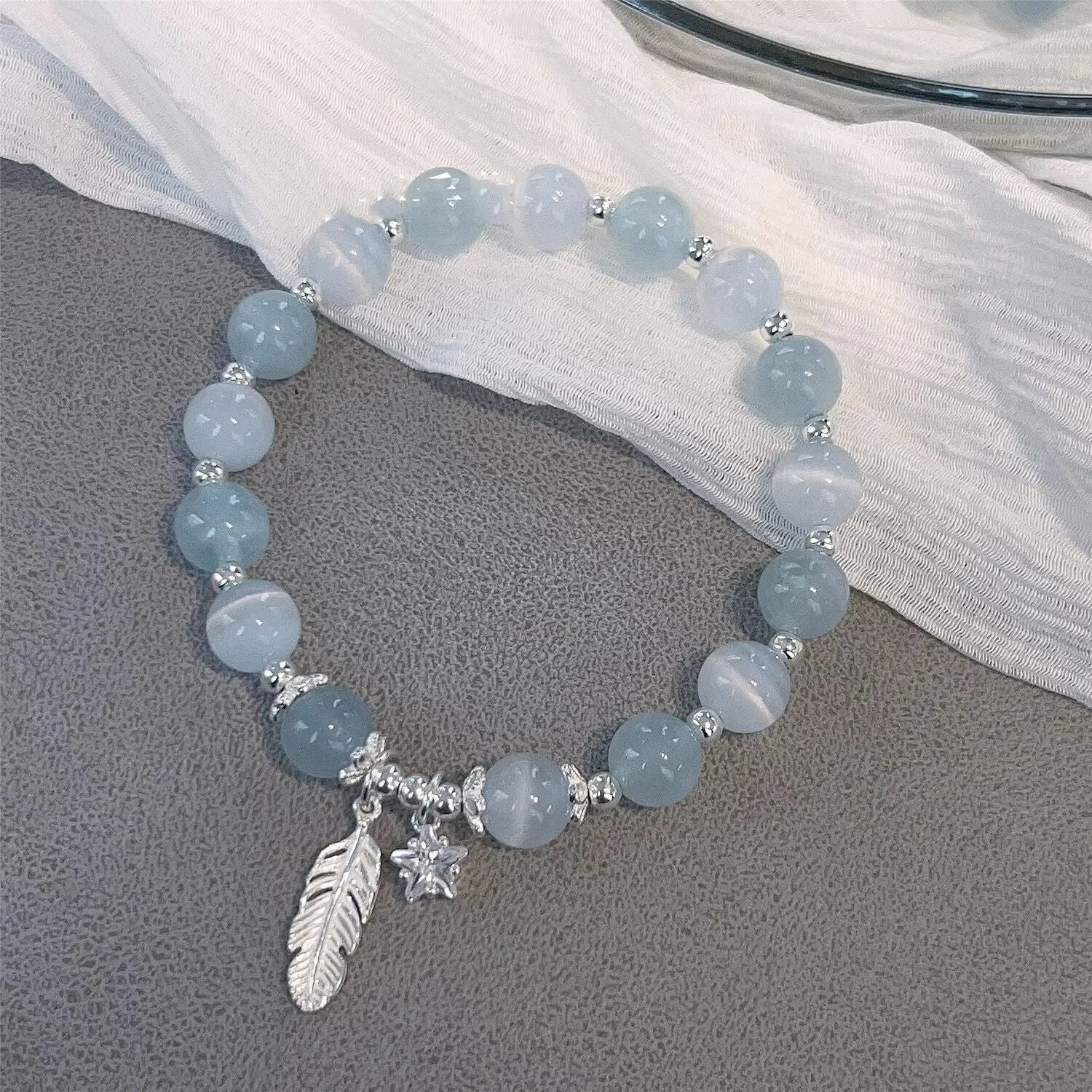 Korean style glass crystal bracelet with feather XingX blue moonlight colour and eight Awn star design