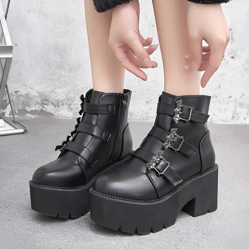 Black women's punk gothic short boots with bat buckle and side zipper on thick heel.
