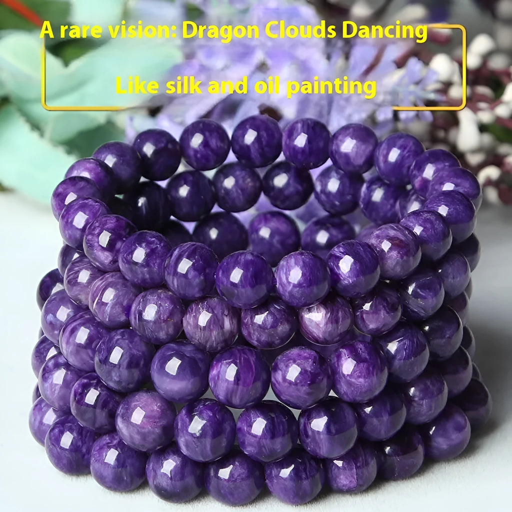 Purple charoite gemstone beaded bracelet with a platinum clasp.