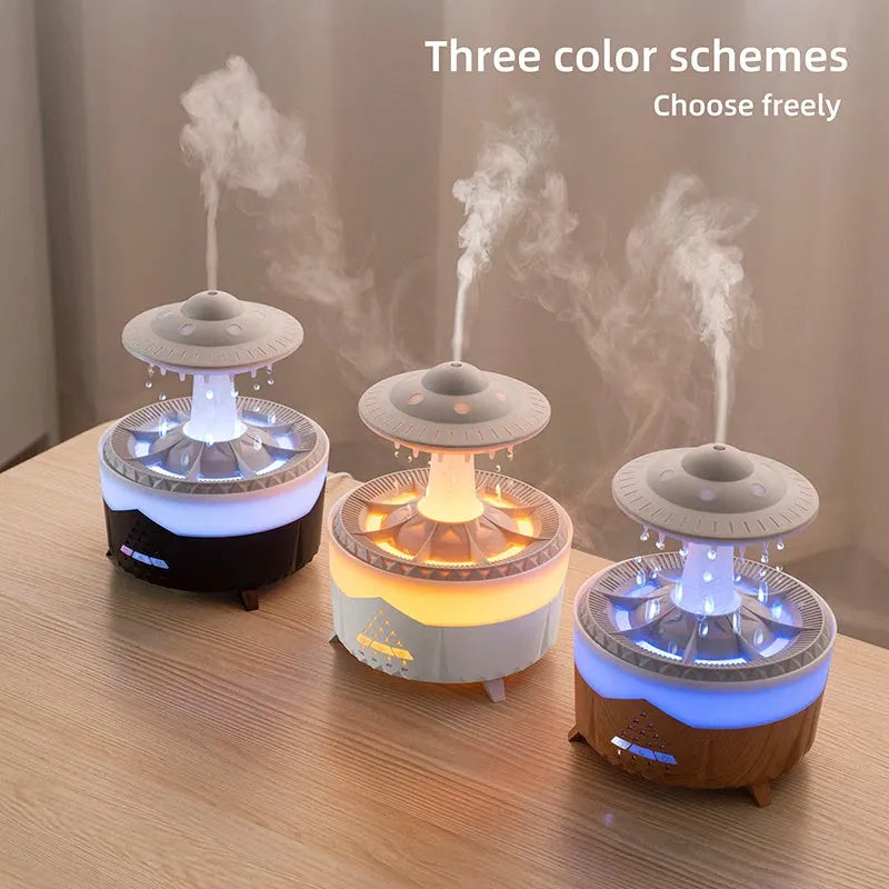 White cloud-shaped humidifier with water droplets and coloured lights on wooden surface