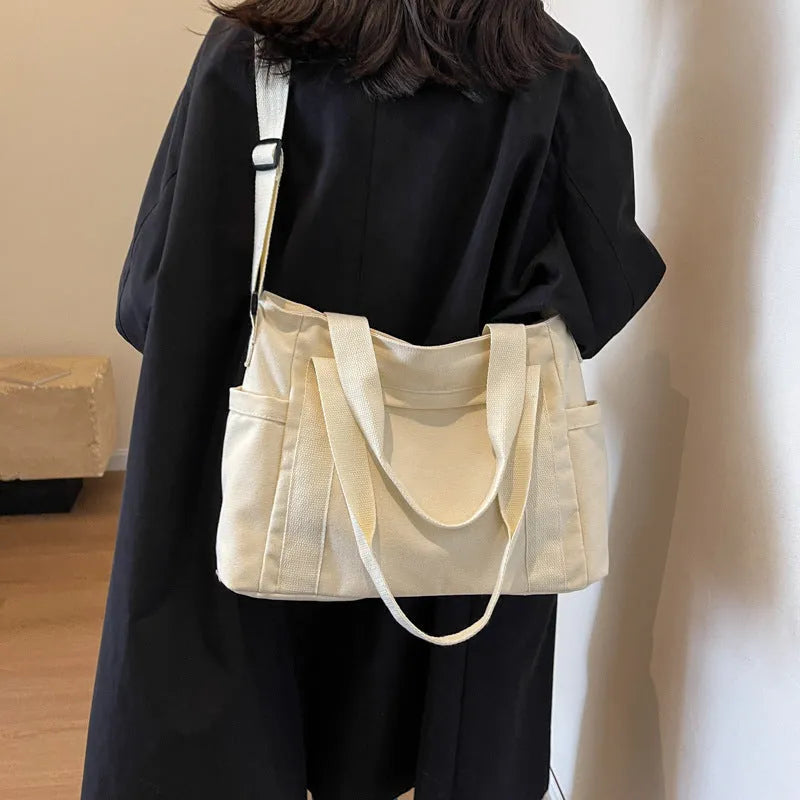 Large capacity canvas shoulder bag with sandwich pocket design in solid colour options
