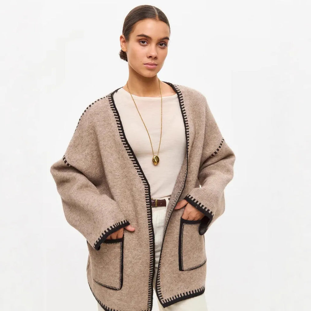 Loose fit lace-up front knitted cardigan in black, camel, or white colours.
