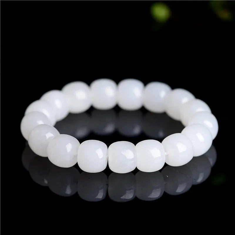 White Hetian jade barrel beads bracelet laid flat, showing bead sizes 5x6mm, 7x8mm, and 8x10mm.