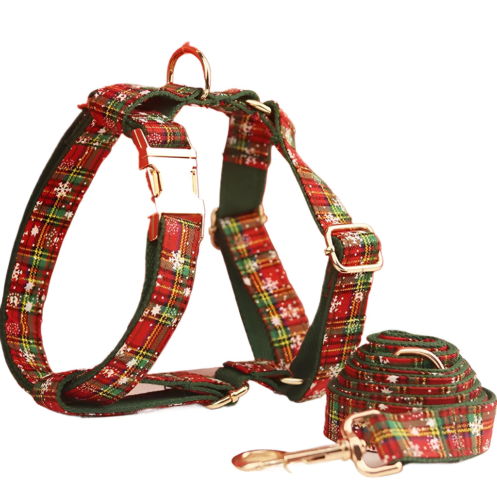 Christmas pet collar four-piece set with green background snowflake design showing dog collar, leash, vest and matching bow