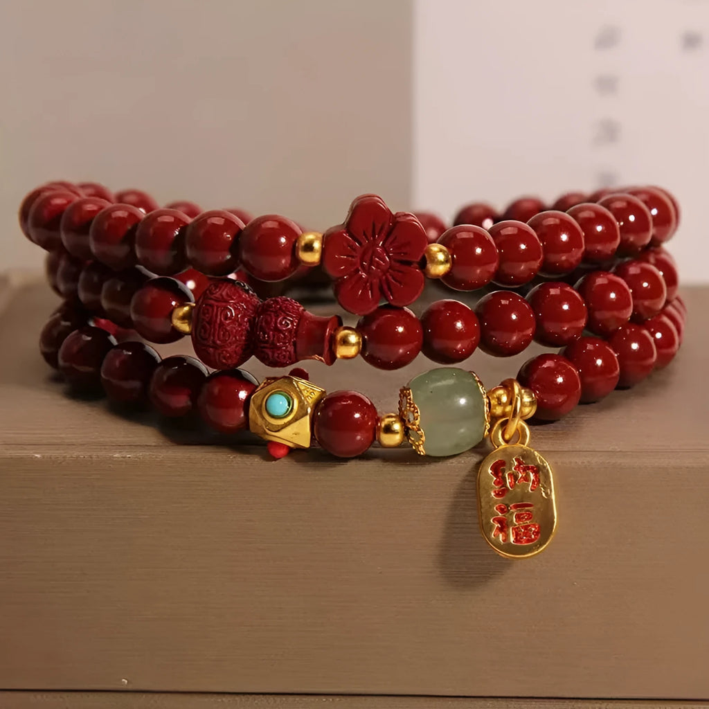 Red cinnabar bracelet with 6mm beads showing multi-circle gourd and five petal flower geometric design
