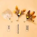 Set of three small cat toys with colourful flying insect heads on thin steel wires.
