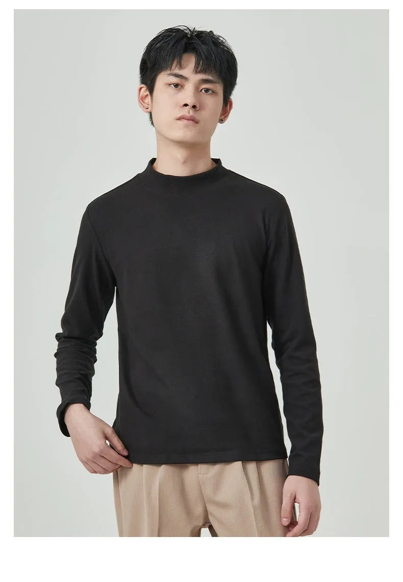 Man wearing a beige Dralon long sleeve T-shirt with a half-high collar, casual autumn outfit.