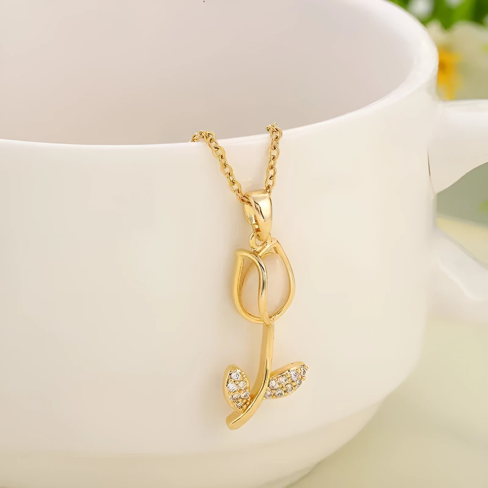 Zircon tulip flower pendant necklace for women on an O-ring chain, shown in a gold colour finish.