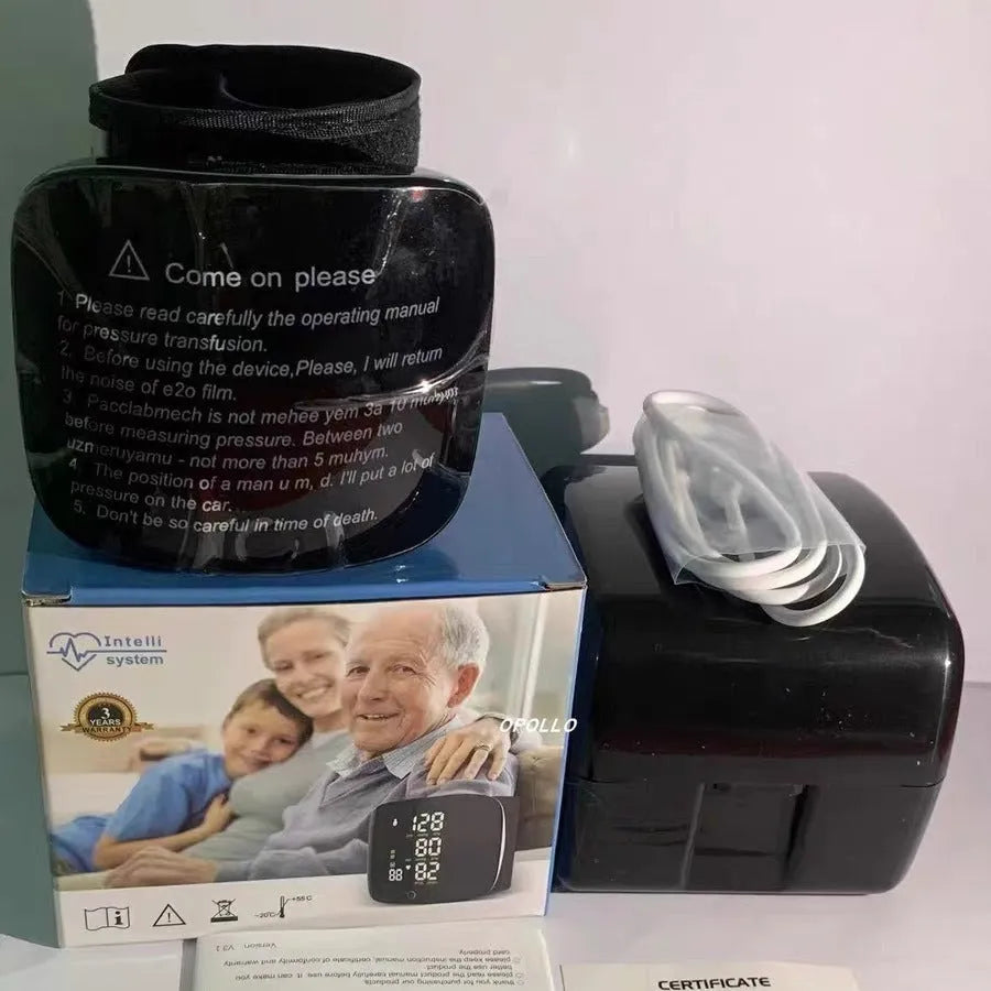 Black wrist-cuff blood pressure monitor with USB charging port and display.