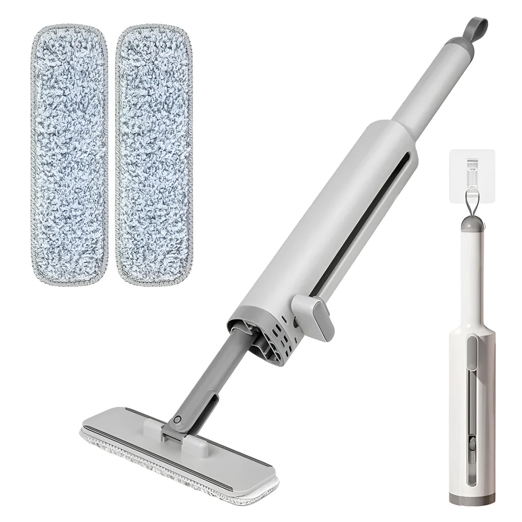 Pink rotatable self-squeeze flat mop with microfiber pad extended on a floor.