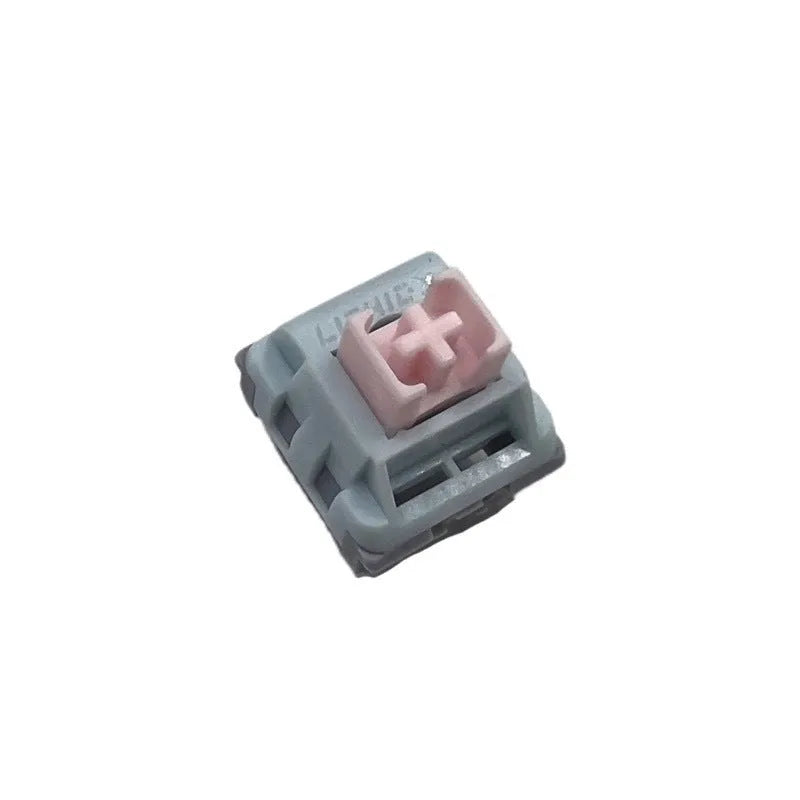Four Dew Axis-4 coloured linear silent mechanical keyboard switch bottoms showing internal spring and shaft core.