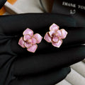 Gold plated copper flower stud earrings with purple oil-spot glaze finish and floral shape design